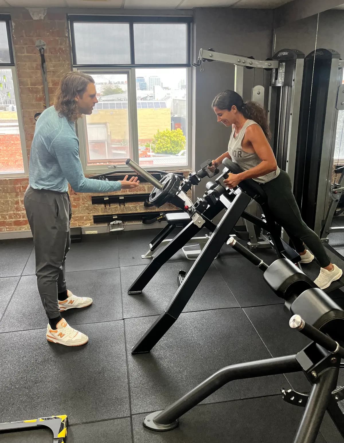 Scott coaching Renee through a set at the State of Fitness studio in South Yarra