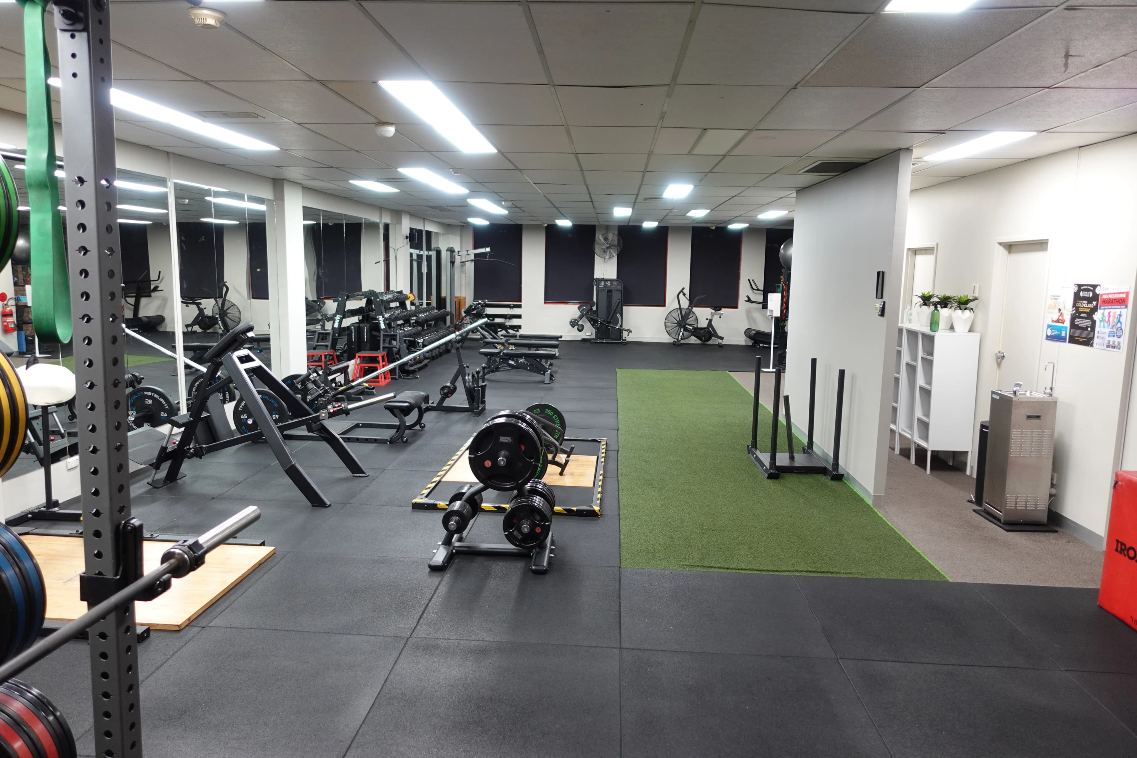 Wide view of the State of Fitness South Yarra studio with members training during a session.