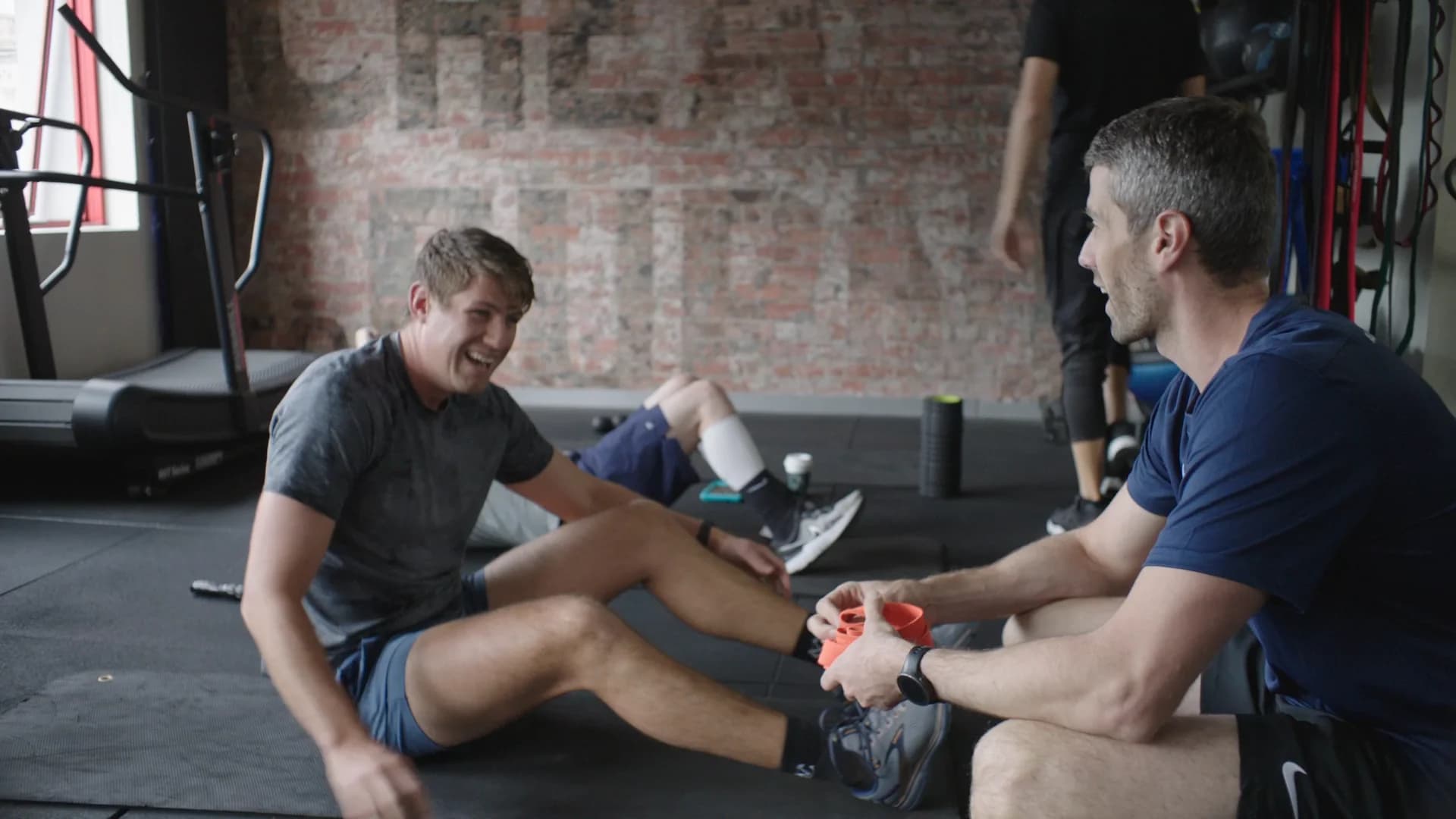 Dylan Jones, founder of State of Fitness, sharing a laugh with a member mid-session at the South Yarra studio