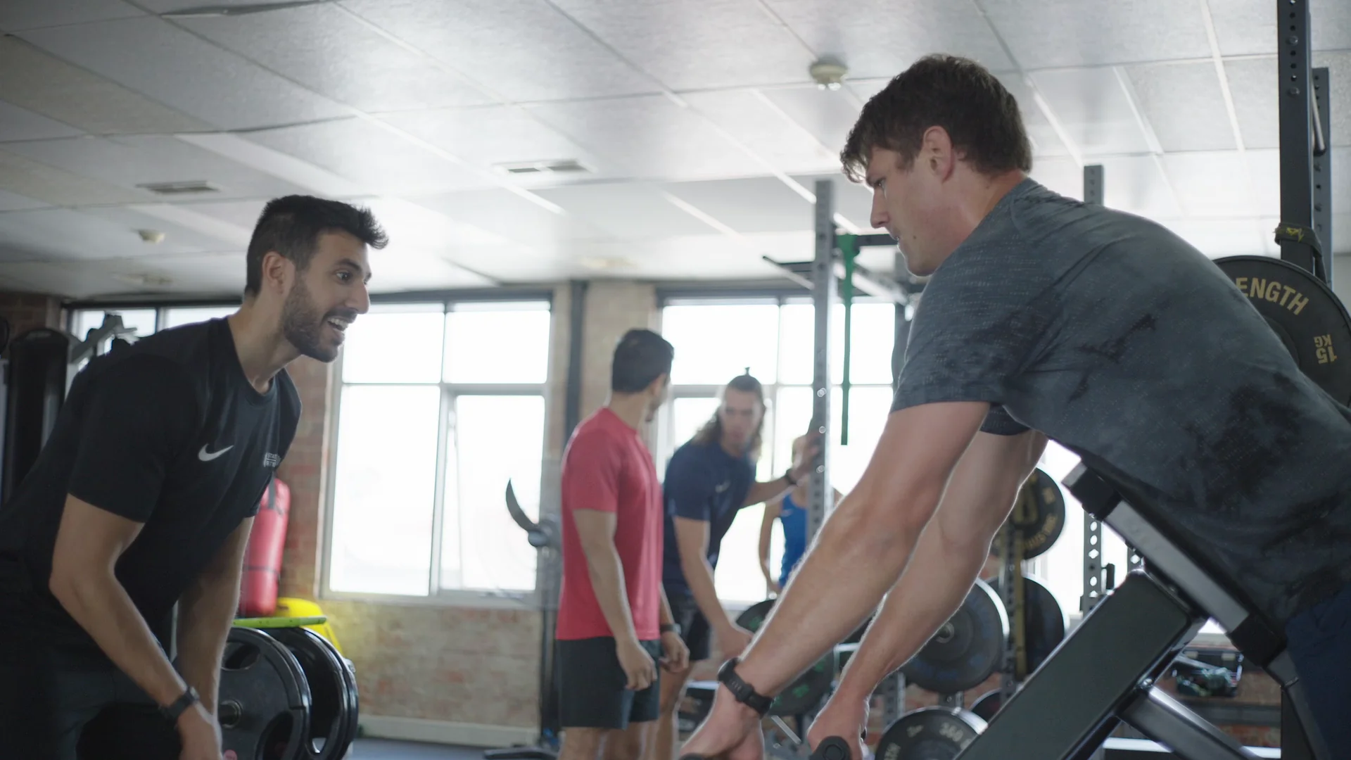 Coach working 1:1 with client at State of Fitness