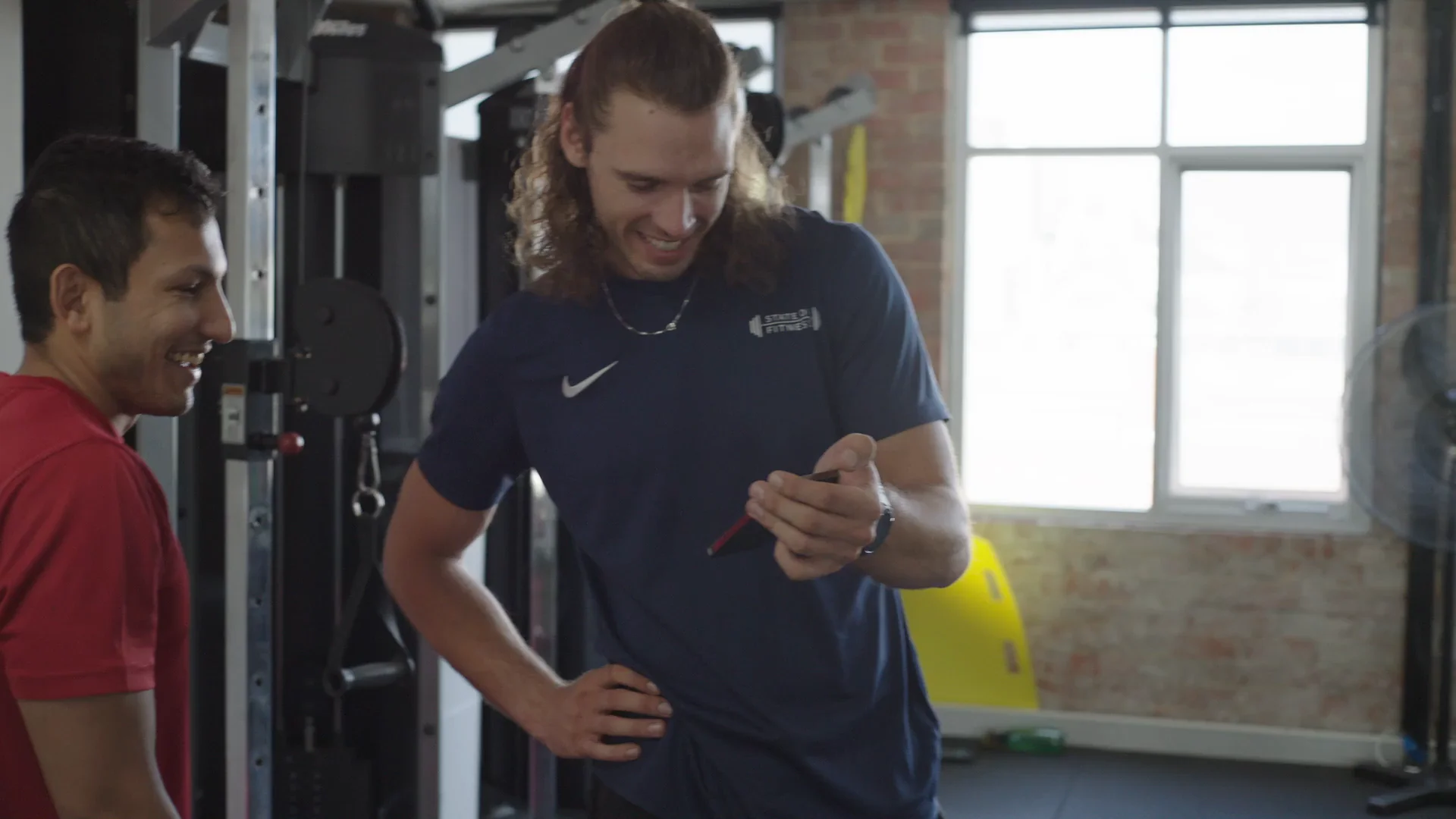A coaching session on the gym floor at State of Fitness