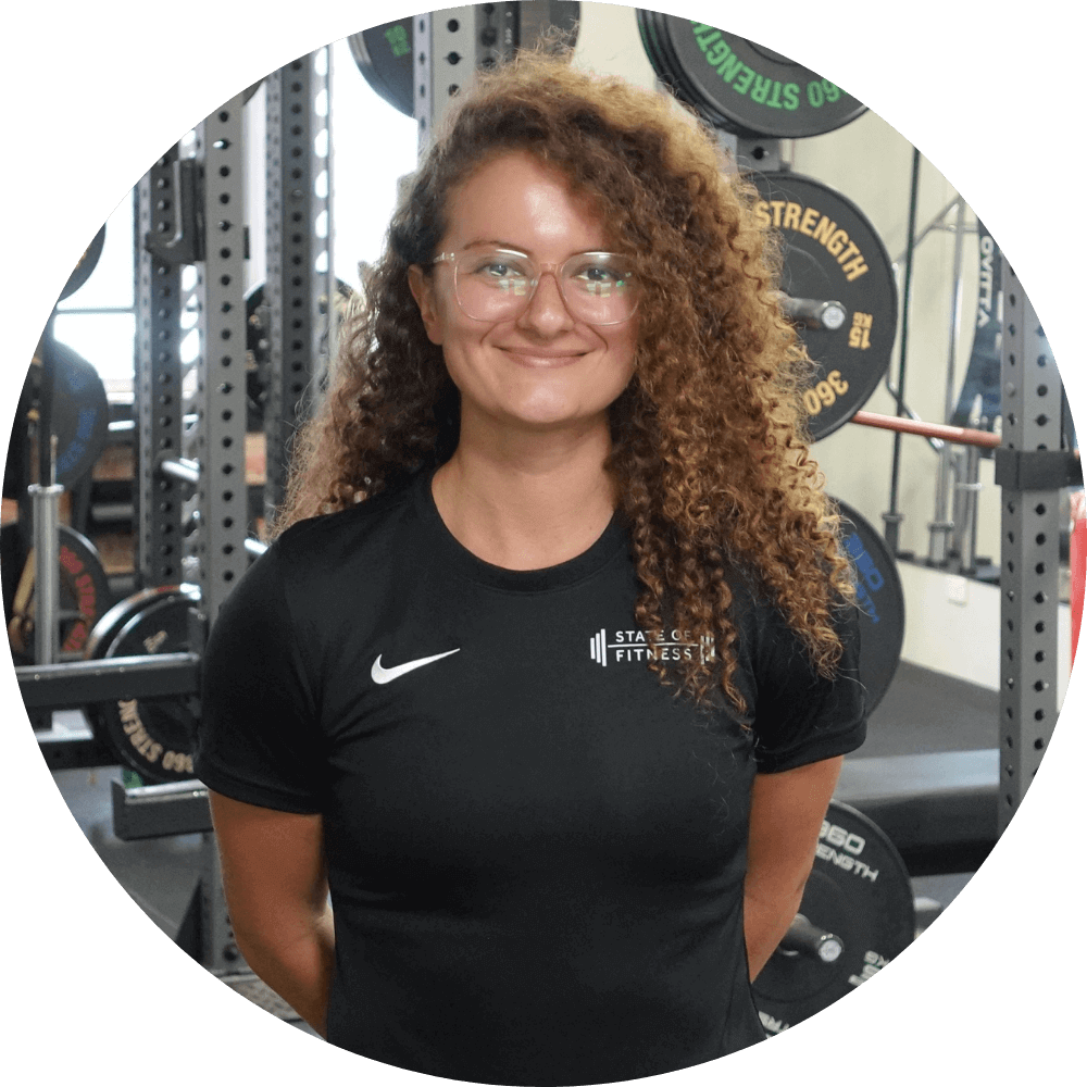 Ruby Fraser, a State of Fitness expert, happily poses for the camera, showcasing her enthusiasm for fitness.