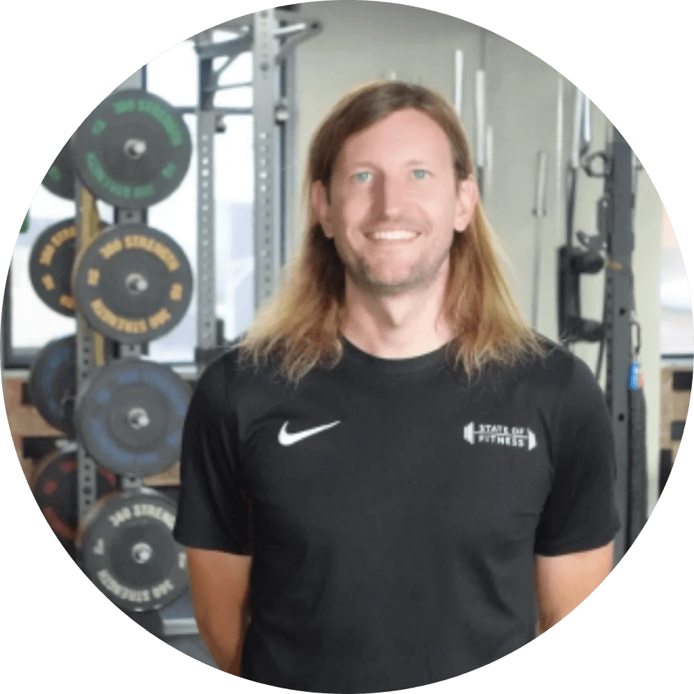 Alwyn Jones, Head of Athletic Development at State of Fitness, looks motivated and prepared for a workout.