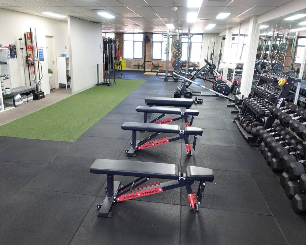 The interior of the State of Fitness is well-equipped with modern fitness equipment for effective workouts.