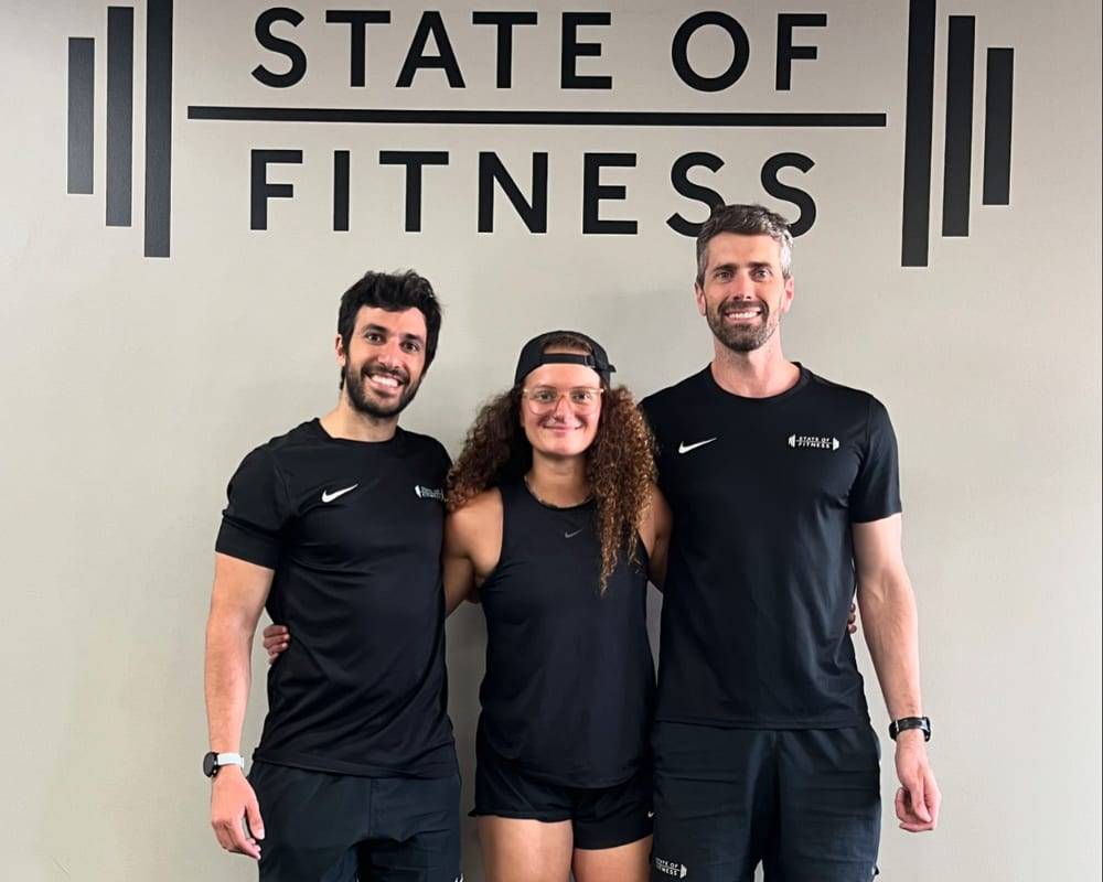 The State of Fitness team poses together for the camera, showing the importance of physical fitness.